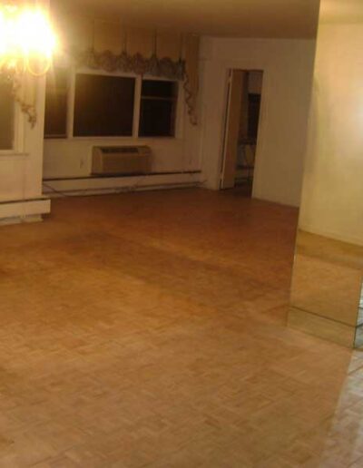 An empty room with a mirror.