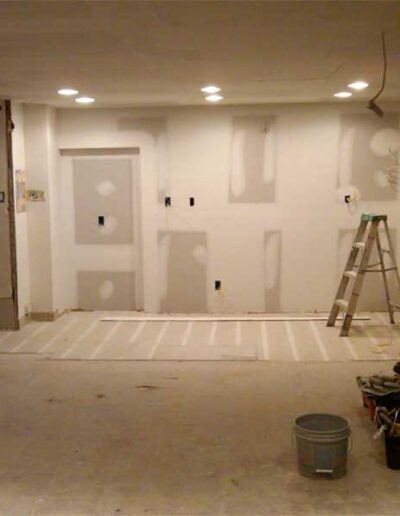 A room that is being remodeled with drywall and paint.