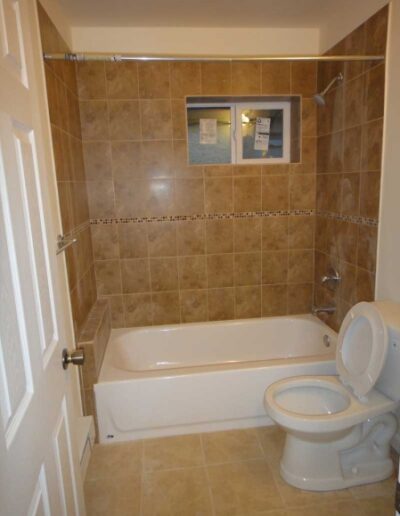 A toilet in a bathroom.