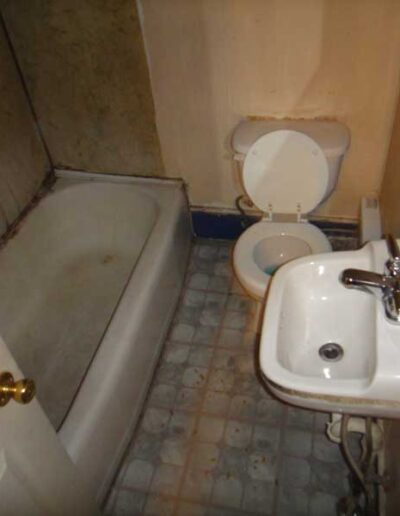 A bathroom with a toilet and a sink.